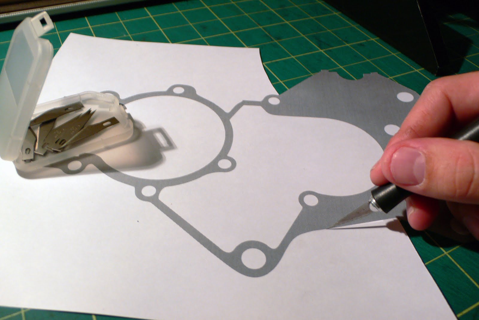 cut out the printed paper gasket utilizing an Xacto knife and