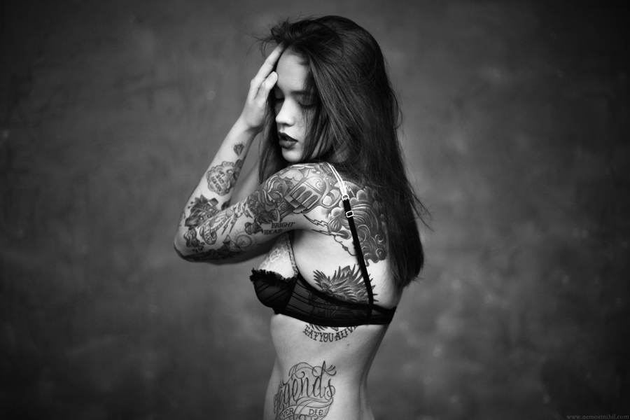 Fine naked girl with tattoo