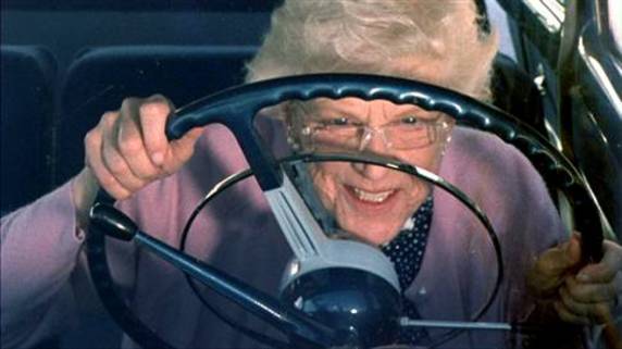 Old lady driving a car