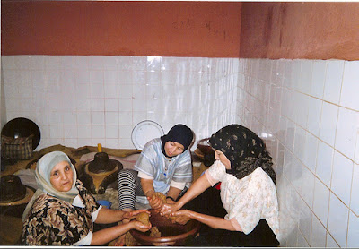 persing and extracting argan oil with hands