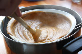 Straining the butternut squash soup