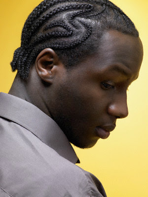 Man with cornrow hairstyle