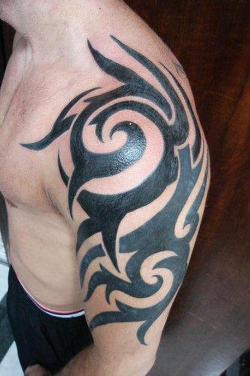 tribal tattoos for men shoulder and arm. tribal tattoos chest to arm.