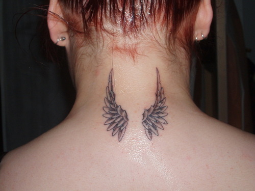 tribal tattoos of angel wings. Image by cwalker71 tribal sun