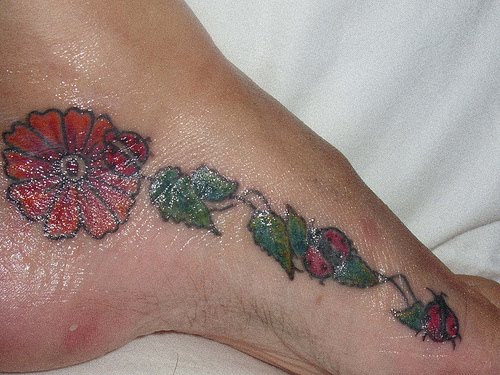 Flower foot tattoos can either
