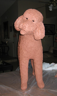 clay poodle styrofoam is coated with modeling clay