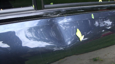 car dent from storm