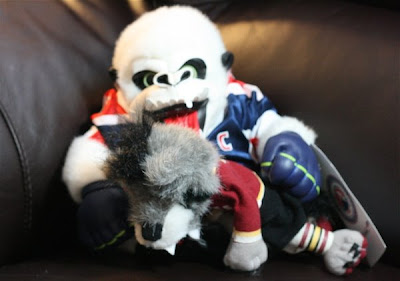 Credit:Jane Rickard, Syracuse Crunch mascot, Al the Ice Gorilla spanks Skates the Wolves mascot in a symbolic gesture.