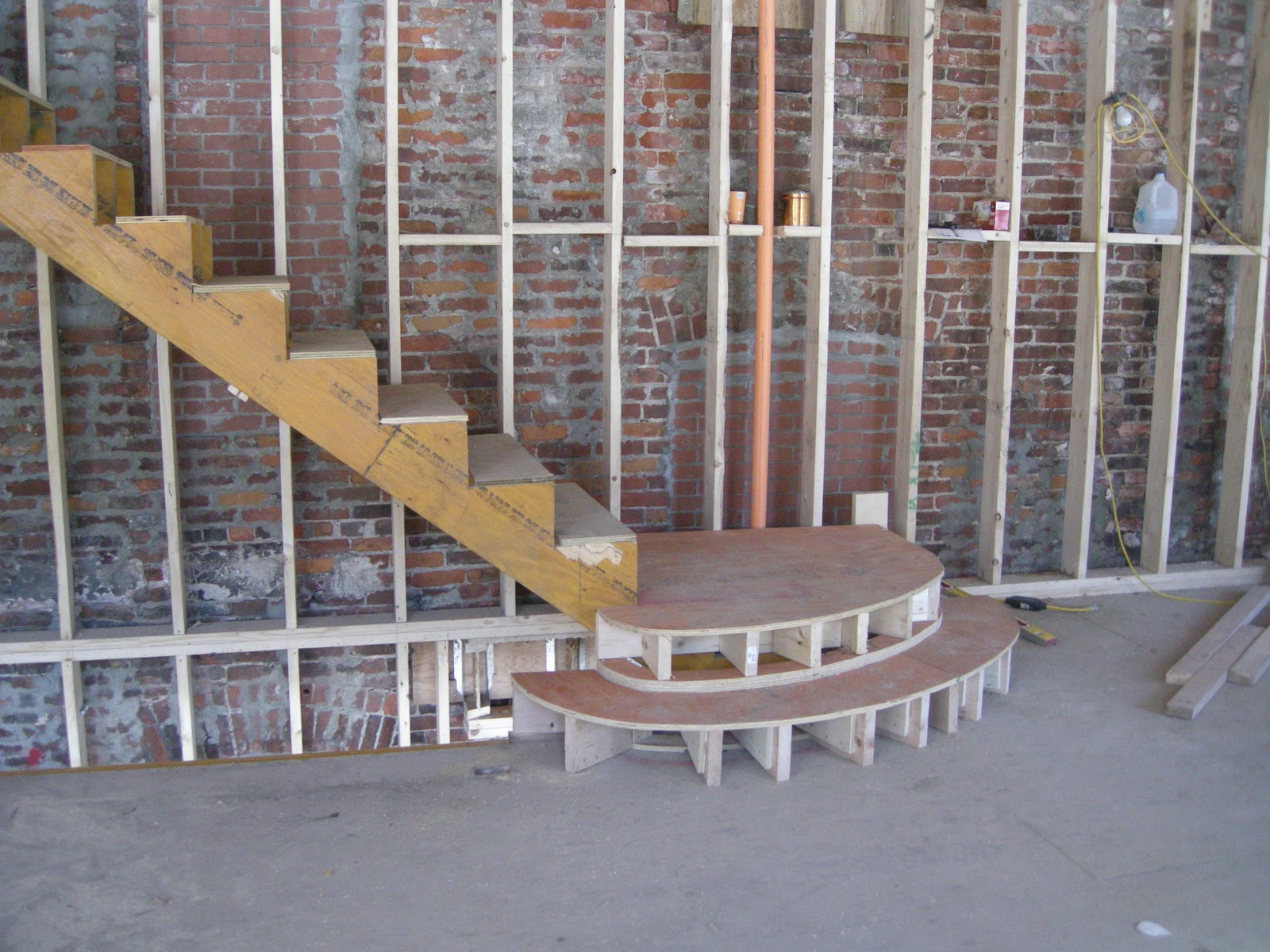 redbrickbuilding Staircase framing begins in our unit
