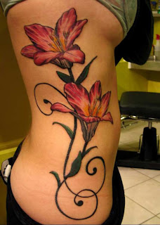 lower back hawaiian flower tattoos
