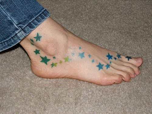 small star tattoo on foot