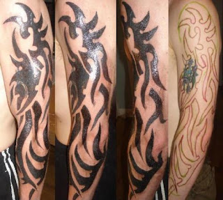 tribal design tattoos on arm