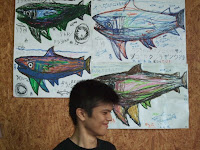 The shark artist with some of his drawings
