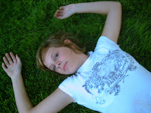 Lacey laying out in the grass.....she is quite an artist in taking pictures.  Especially of herself