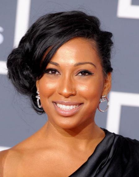 This is a lovely updo sideswept style as worn by Melanie Fiona