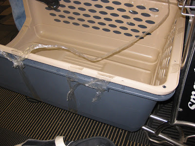 photo of the amazing tape job on our crate, especially of my frenetic tape the entire crate handiwork!