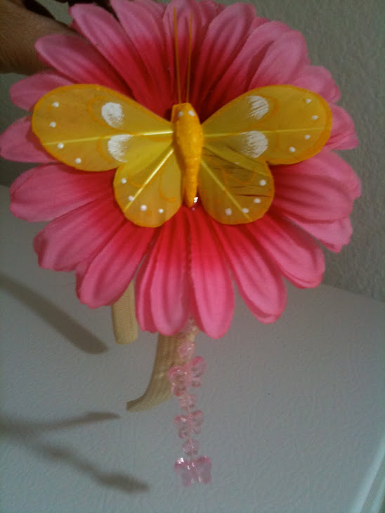 Flying butterfly and pink flower