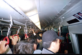 Travelling in the "Local MTR trains" in HongKong at peak hours.