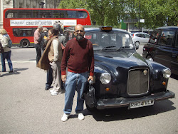 Self outside Westminister abbey posing eith the famous "London Taxi"(Sunday 30-5-2010)