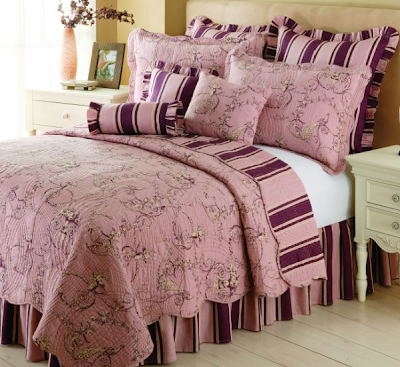 With a mix of classic patterns and vivid colors the Aubergine Peacock Quilt