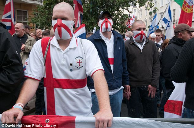  and wear masks emblazoned with the red cross of the Knights Templar