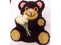 Teddy Bear Holding Dasies