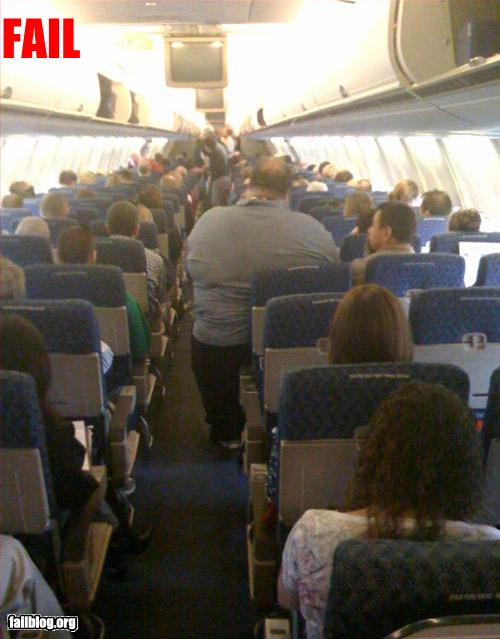 airplane_seat_obese_man.jpg