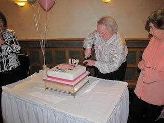 Nan Blair cuts the cake