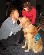photo of Irish Rovers founder George Millar and his wife Betsy getting kisses from Sophie