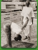 Acaryaji instructing a western woman