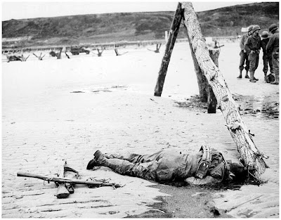 A dead American soldier on a French beach after D-Day