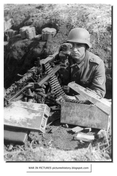 A Wehrmacht soldier is ready with his MG34 machinegun