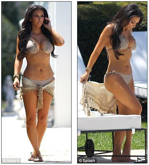 Kim Kardashian shows off her newly tanned legs in figurehugging green dress