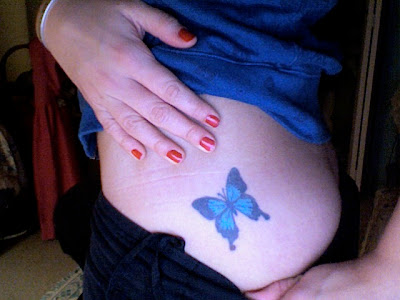 blue butterfly tattoo on side lower back tattoo buttefly very nice
