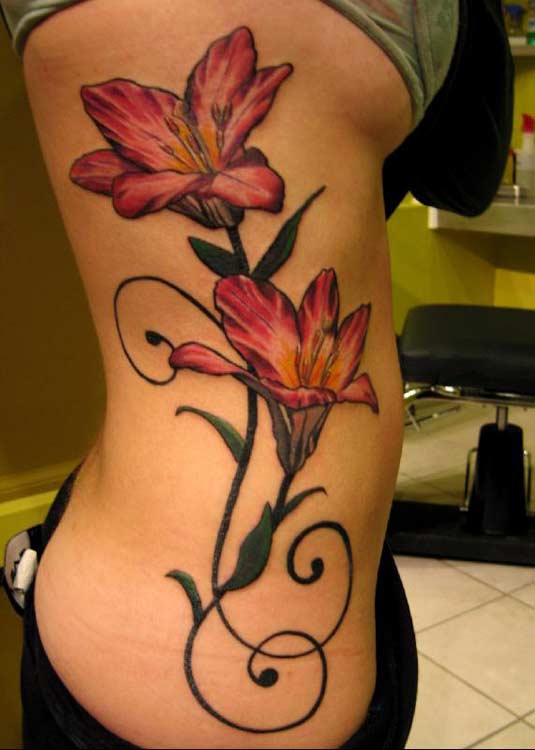 flower tattoos on side of hand. side tattoos