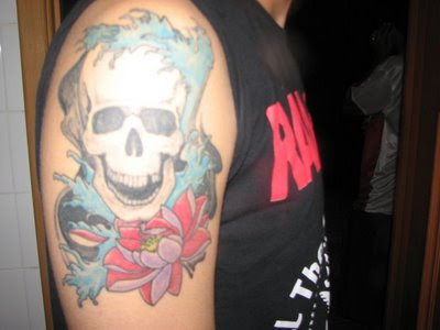skull and flower tattoo, arm upper tattoo
