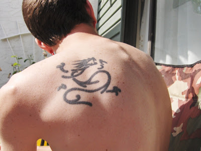 line dragon tattoo, back upper tattoo design