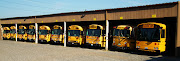School buses in the school bus house. make me think of