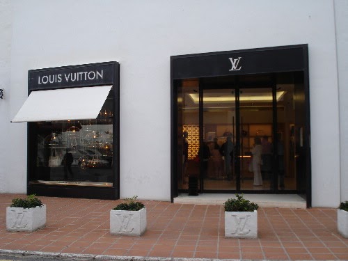 Detail of brand logo of a shop of Louis Vuitton, Marbella, Spain