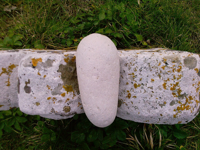 PEBBLE ON A GRAVESTONE