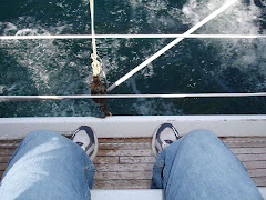 Water coming over the side of the Barbary as the wind hits the sails