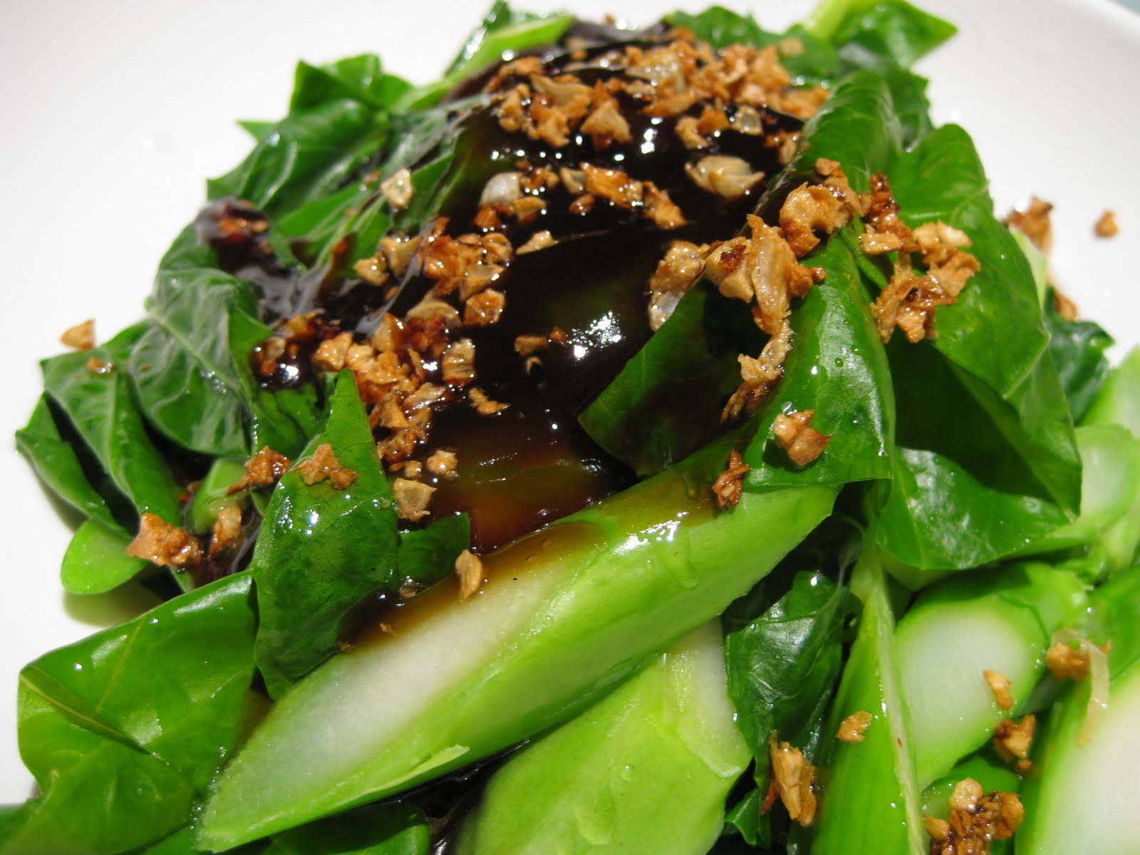 Cook Braised Chinese broccoli with crispy garlic and oyster sauce