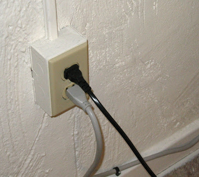 electrial outlet sticking out from the wall