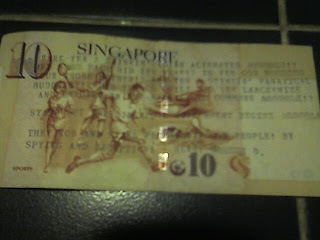 vandalized singaporean ten dollar note