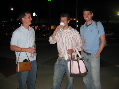 boyfriends holding purses