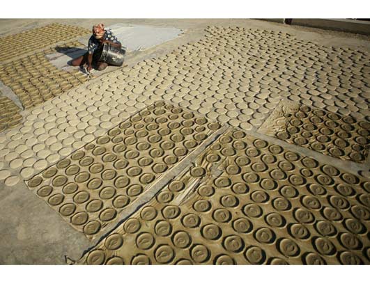 Drying Mud Cookies in the Sun