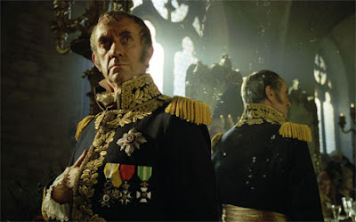 Zarniwoop has a third arm, just like Zaphod