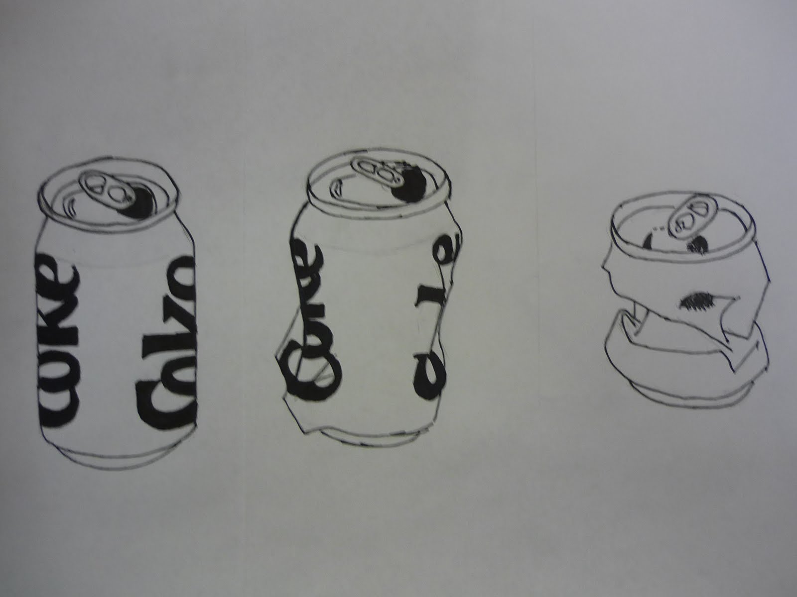 Today we tracing the line drawings of the crushed soda cans we drew. 
