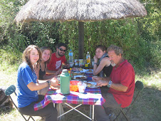 Clients having lunch at a campsite