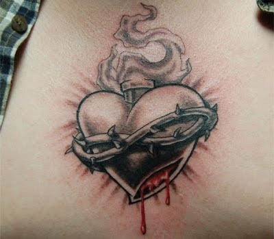 Old School traditional style heart and dagger knife tattoo